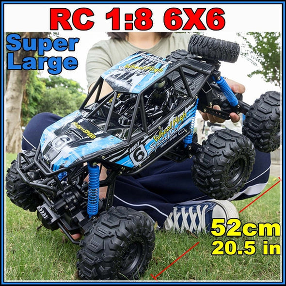 1:8 Scale LARGE RC 4WD 4X6 Rock Crawler with 6 Wheels - Black with blue sticker decals with Rubber Tyres 2.4 GHz